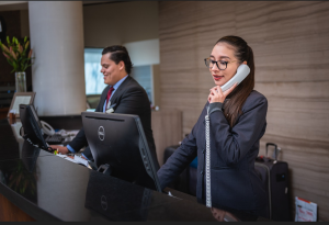 An image of hotel reception staff - employee empowerment